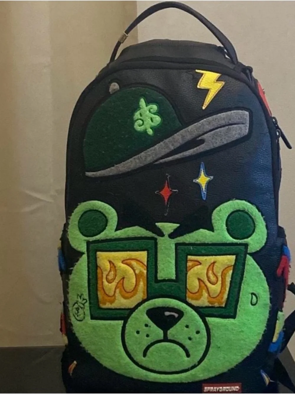 Black Backpack with Neon Green Bear Patch and Graphic Accents
